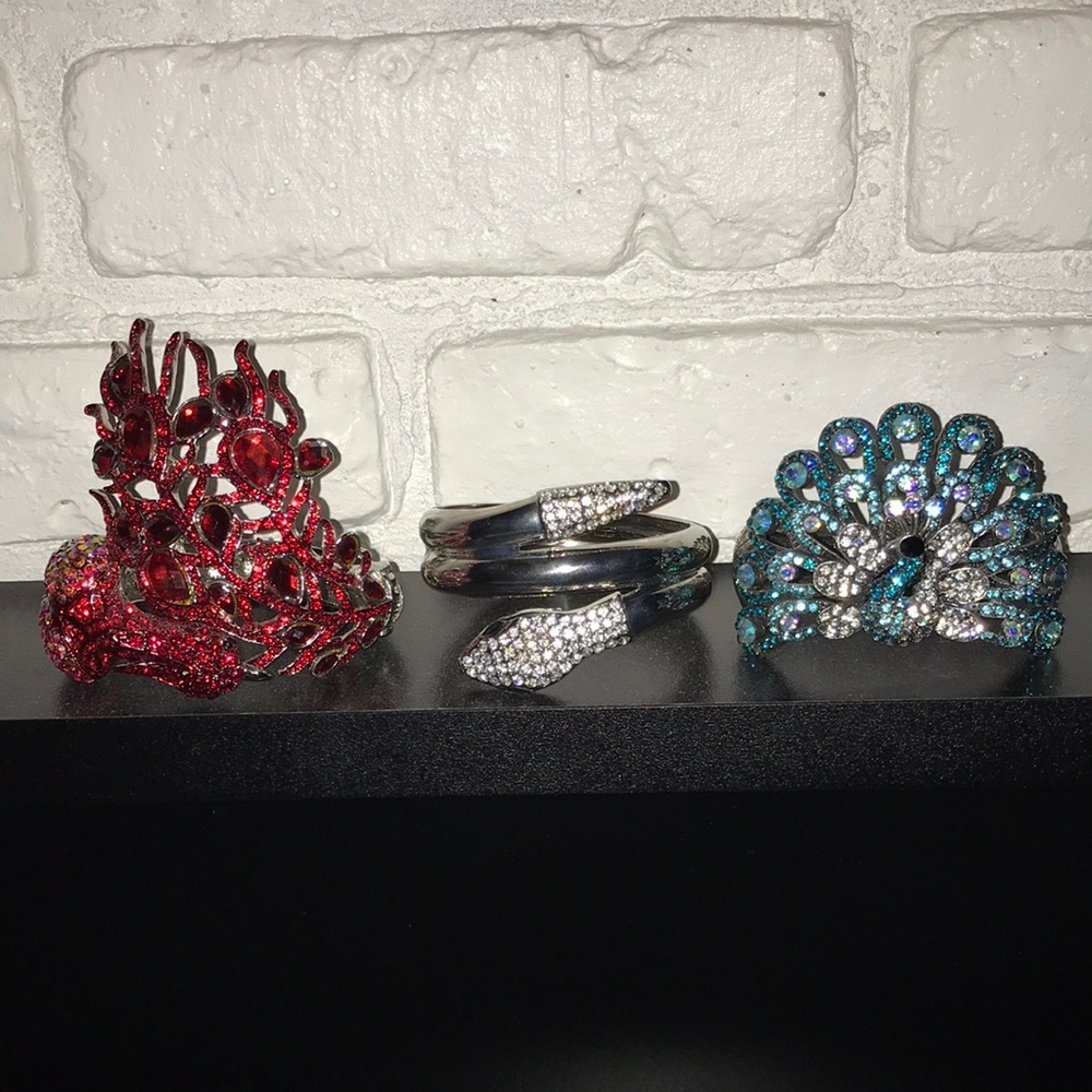 Set of 3 rhinestone hinged bracelets.